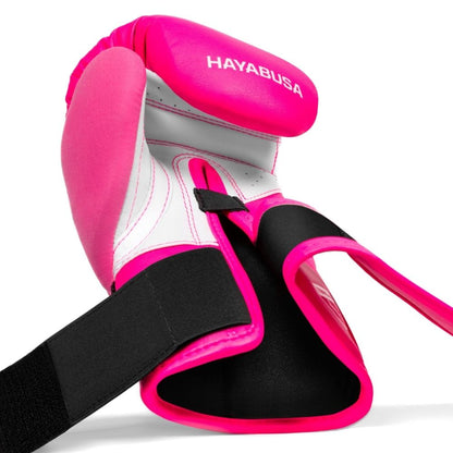 Pink and white boxing glove with black strap on a white background, featuring the Hayabusa brand.