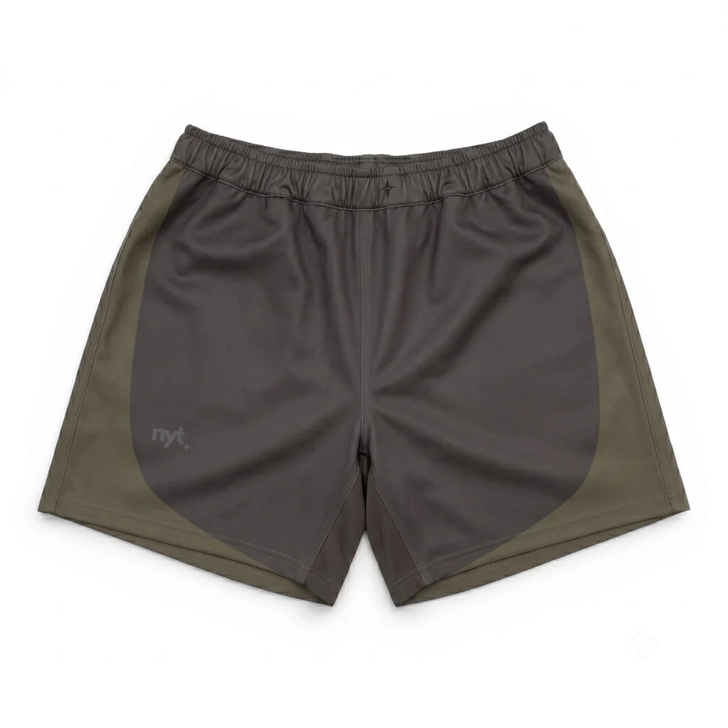 Two-tone shorts with a dark gray front and green sides on a white background