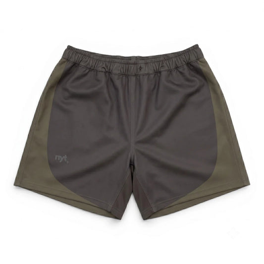 Two-tone shorts with a dark gray front and green sides on a white background